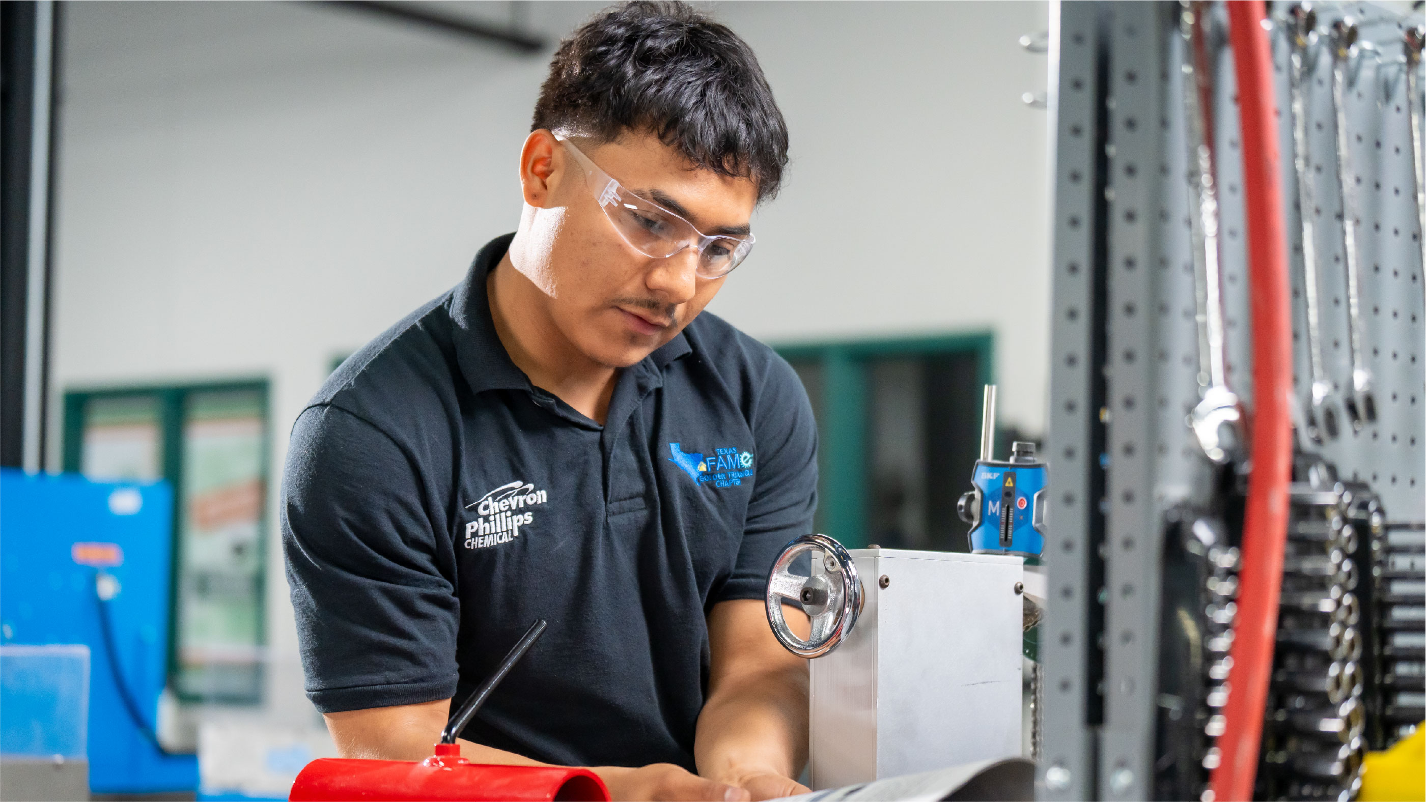 Machining student operating laser alignment equipment